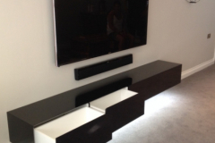 Wall mounted high gloss cabinet.