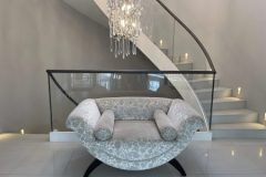 Statement staircase with shagreen embossed leather handrail.