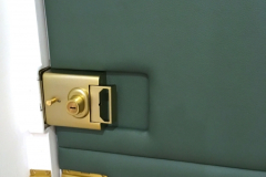 Leather applied to interior front door accommodating existing locks and handles.