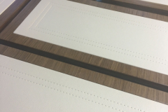 leather panels with stitch detail on drawer fronts.