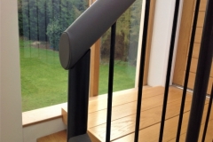 Leather handrail on spindles.