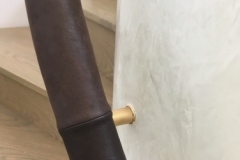 leather handrails on brass brackets