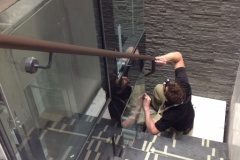 Hand-stitching on leather handrail in Breguet watch store London.