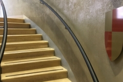 Curved black leather handrail