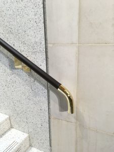 leather on brass handrail